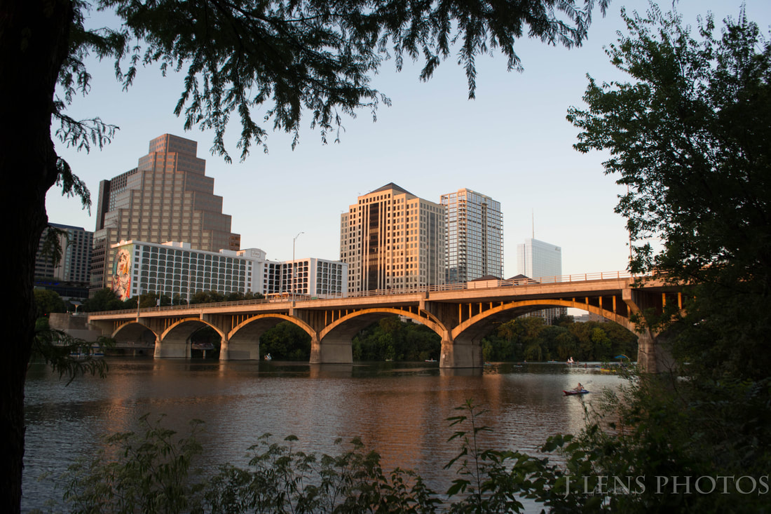Congress bridge in front of luxury apartments downtown Austin